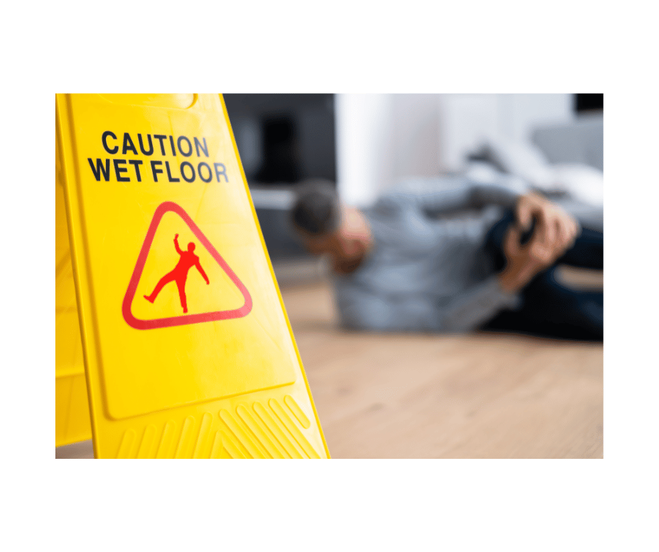 Man hold injured leg after falling on wet floor.
